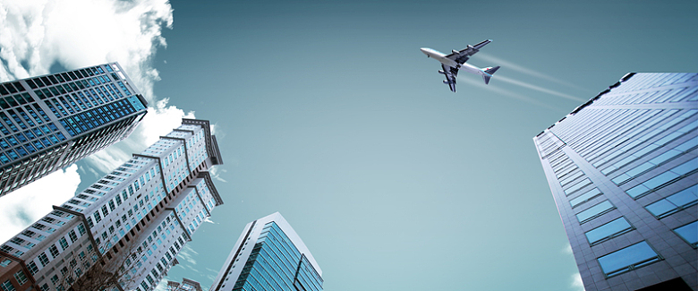 城市建筑商务飞机背景
