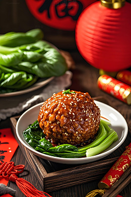 传统美食红烧狮子头摄影图