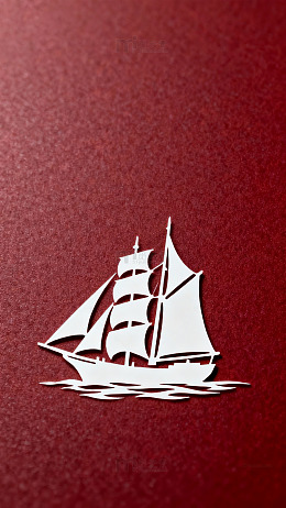 红色背景帆船剪纸艺术