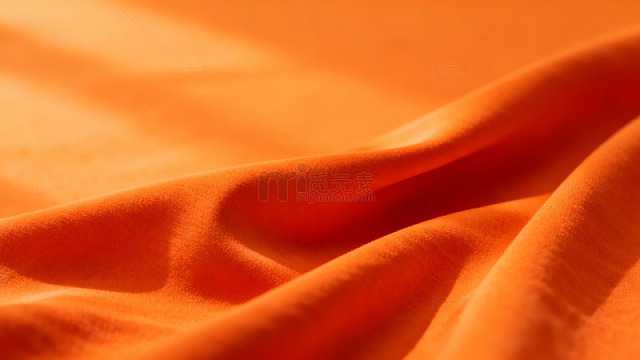 橙色布料褶皱光影特写