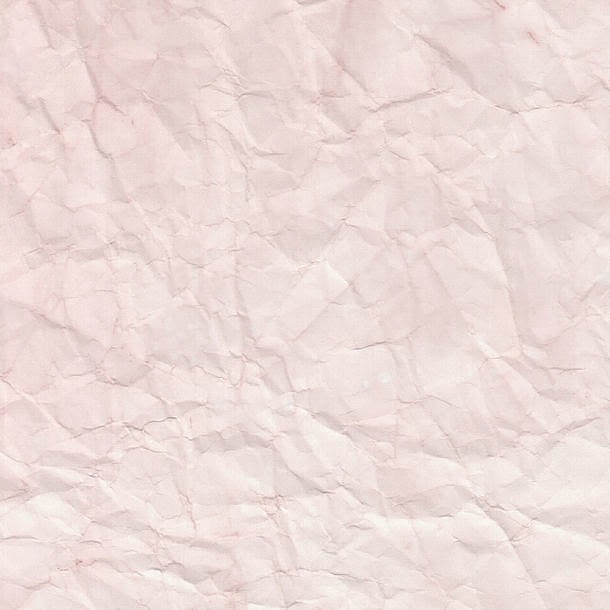 粉色褶皱的纸张背景