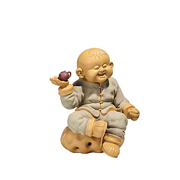 实物手托茶壶的小孩素材
