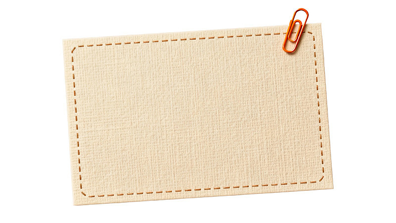 米色布纹纸张配红色夹子