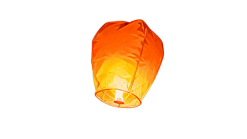 橙色孔明灯漂浮于白色背景