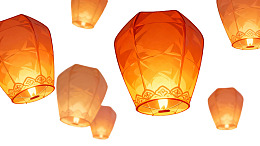 橙色孔明灯空中飘浮图片