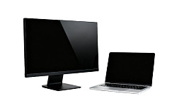 电脑显示器与笔记本电脑并排展示