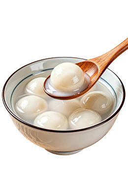 一碗汤圆配木勺图片