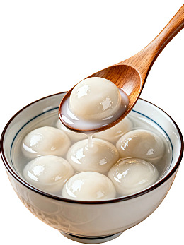 木勺舀起一碗汤圆图片