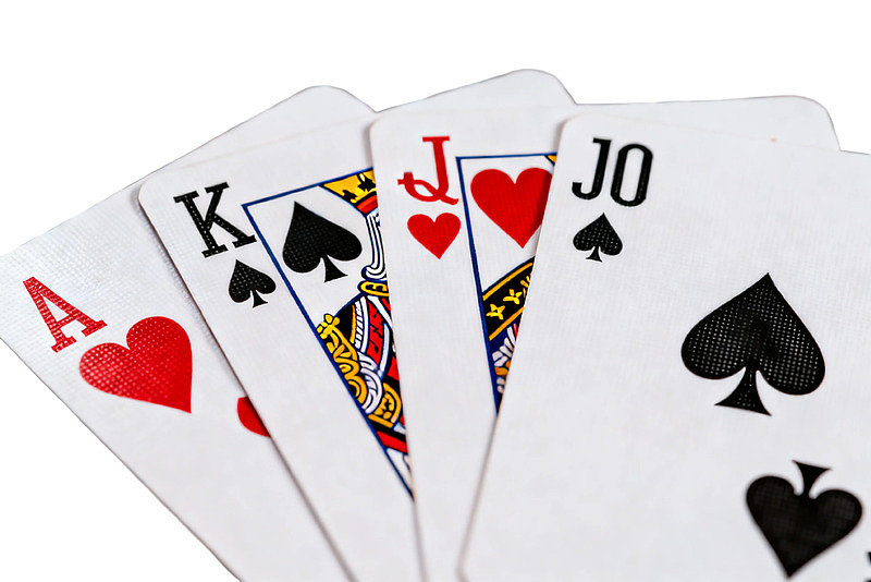 扑克牌四张顺子特写图片