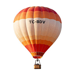 橙白相间热气球空中飞行