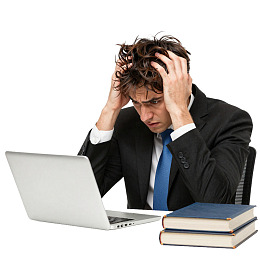 商务人士电脑前焦虑抓头