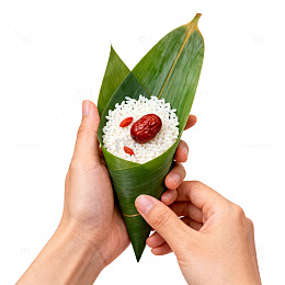 绿色粽叶糯米红枣美食图